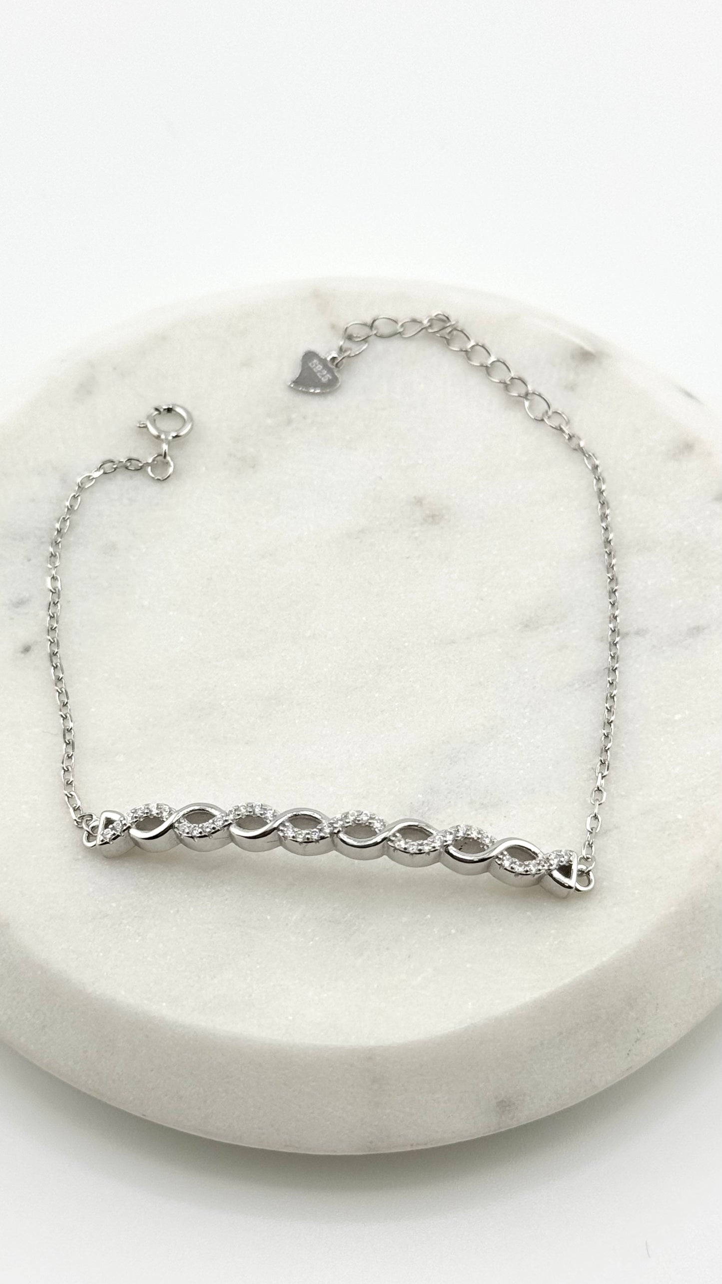 Sterling Silver Bracelet with Criss-Cross Solid Stud Design (Adjustable)